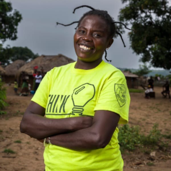 A woman sits outside her home in rural Kwilu Province, Democratic Republic of the Congo, a region affected by tsetse-fly-borne sleeping sickness.