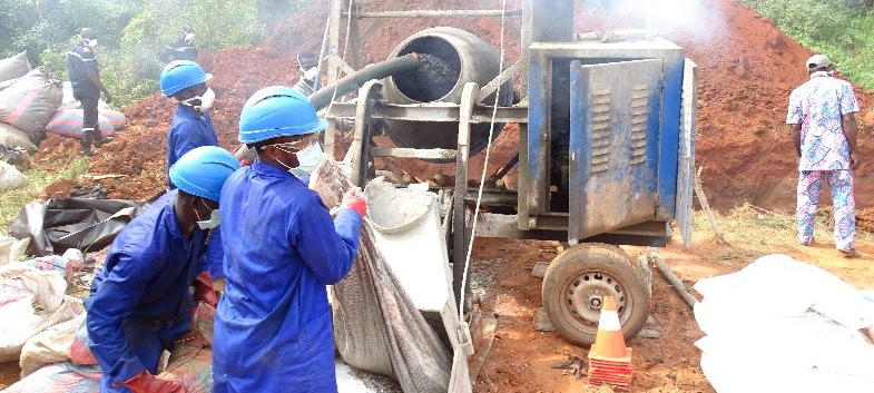 Alt Text: Benin officials inspect seized counterfeit medicines.