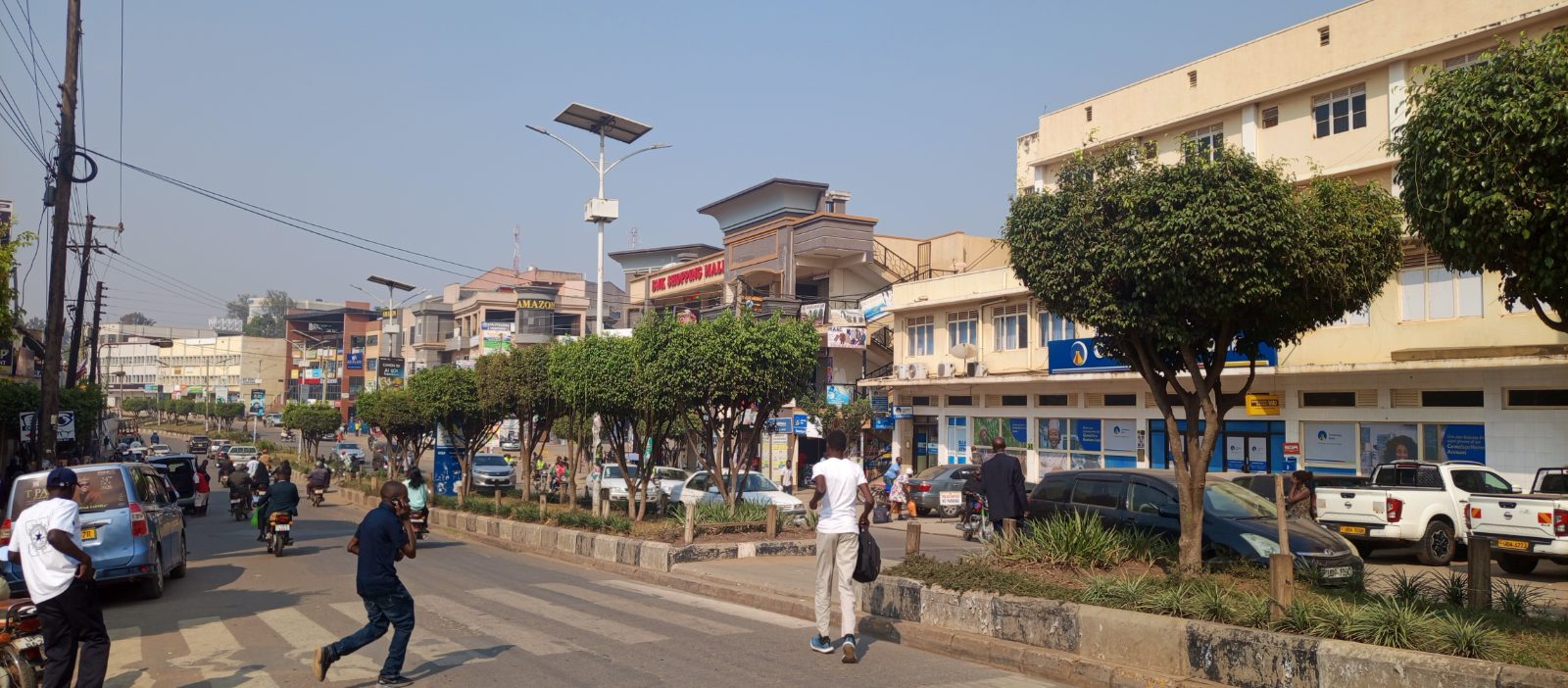 Modern commercial buildings and busy streets along High Street in Mbarara City, Western Uganda.
