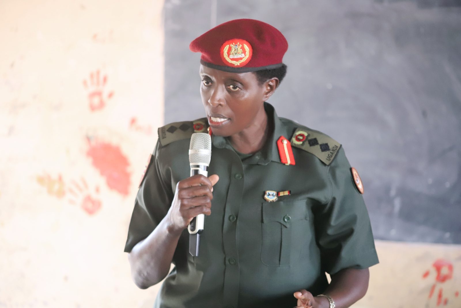 Col. Night Ikiriza addressing Kitende Secondary School students during a lecture on patriotism and mindset change.
