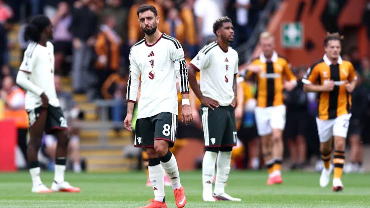 Manchester United players react during their 2–0 defeat to Hull City. Caption