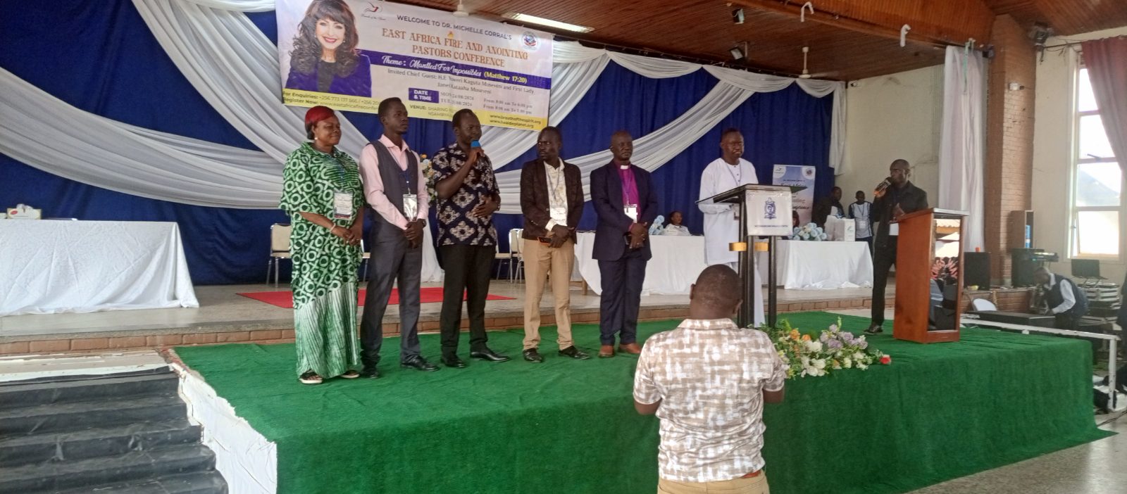 South Sudan delegation led by Amb. Joseph Lupai Charles introducing themselves on stage during the East Africa Fire and Anointing Pastors Conference in Kampala.
