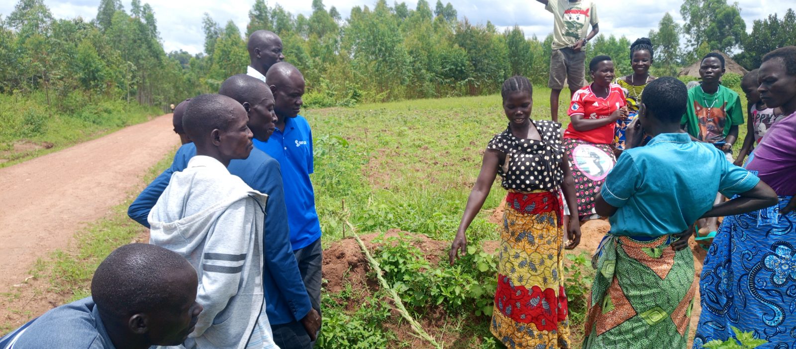Women in Ambala, Adumi Sub-County, participate in a traditional roadblock during a Lugbara customary dowry ceremony involving visitors from Maracha, Yumbe and Koboko districts.