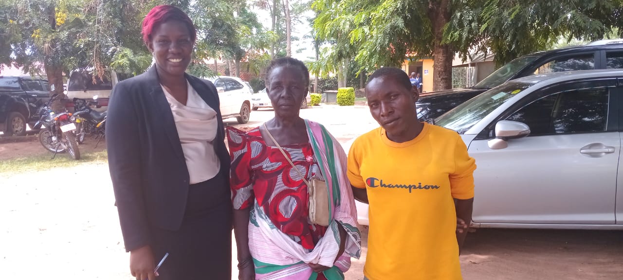 Redeem International legal officer Damalie Nyafono in a suit with her client Mariam Mutesi Tabisa and her son Hassan Sajjabi at Iganga Court during proceedings over a disputed 16-acre family property in Namutumba District.