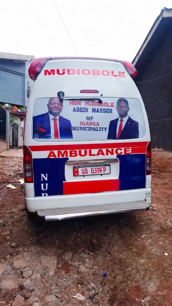 Community ambulance registration number UA 039FP delivered by Iganga Municipality MP Mudiobole Abedi Nasser, branded in National Unity Platform colours.
