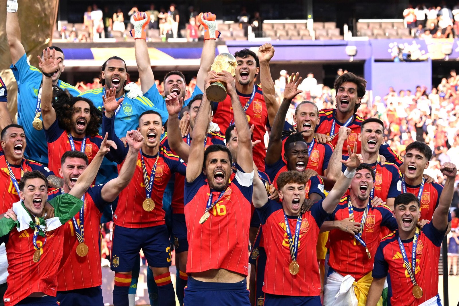 Spain's players lift the FIFA World Cup trophy after beating Argentina in the 2026 final